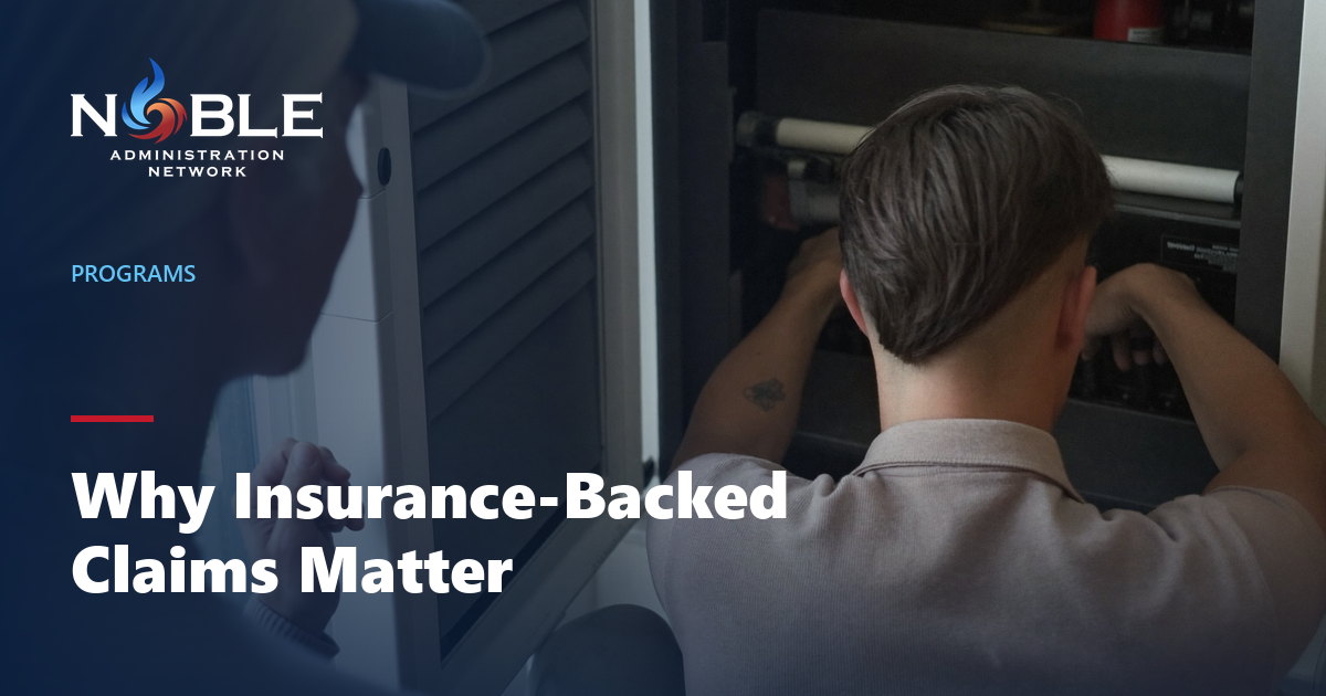 A technician carrying out a repair while the homeowner looks on